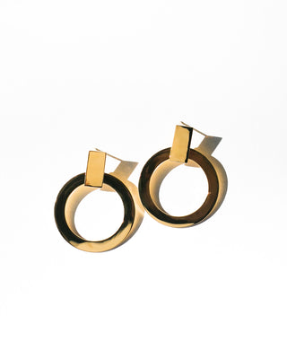 Pair of small gold hoop earrings with rectangular posts on a white background. Featured Product: Millie Hoop, SKU: ER-DC15A-030-RG